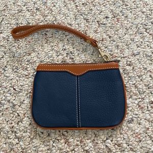 NWOT. Dooney and Bourke All Weather Leather wristlet.